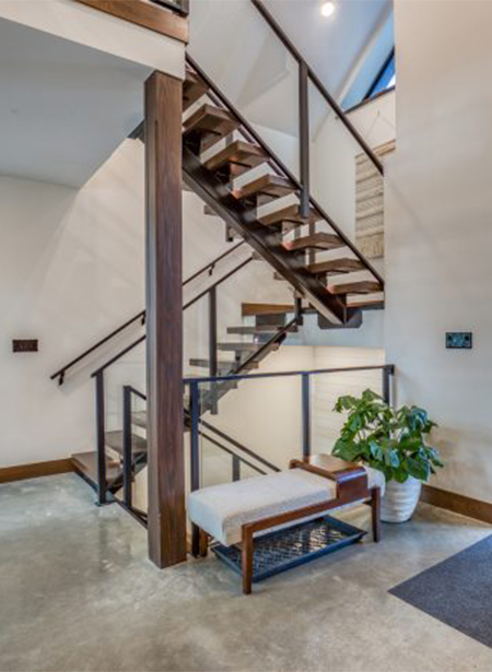 Beautiful Floating Staircase Just Inside Entrance to The Manor McMann Custom Home Builders