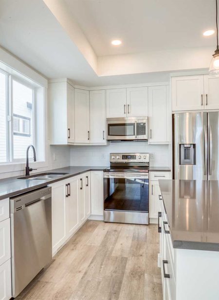 modern-bright-kitchen-with-island-by-McMann-Homes---detached-duplex